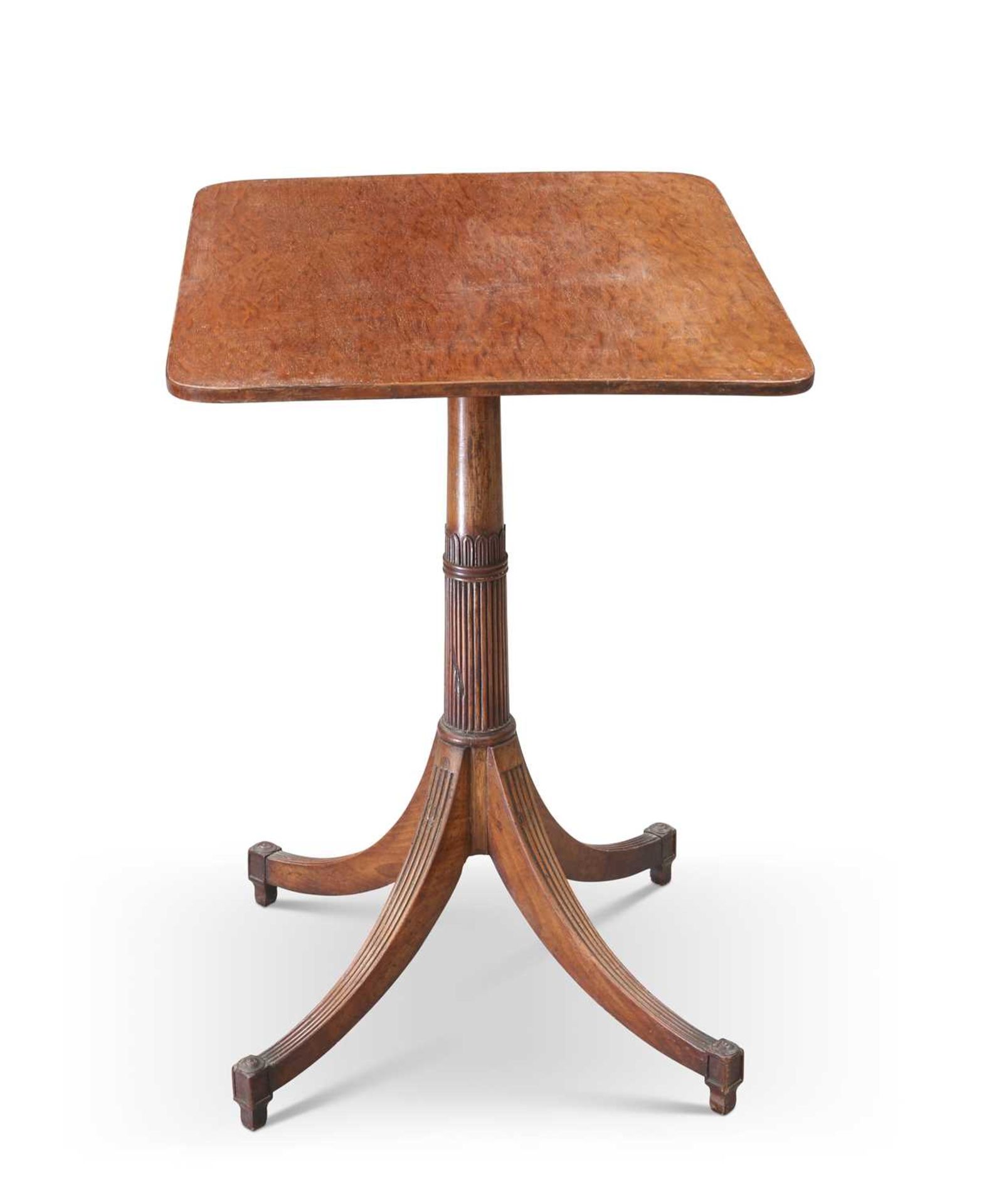 A REGENCY STYLE PLUM PUDDING MAHOGANY OCCASIONAL TABLE