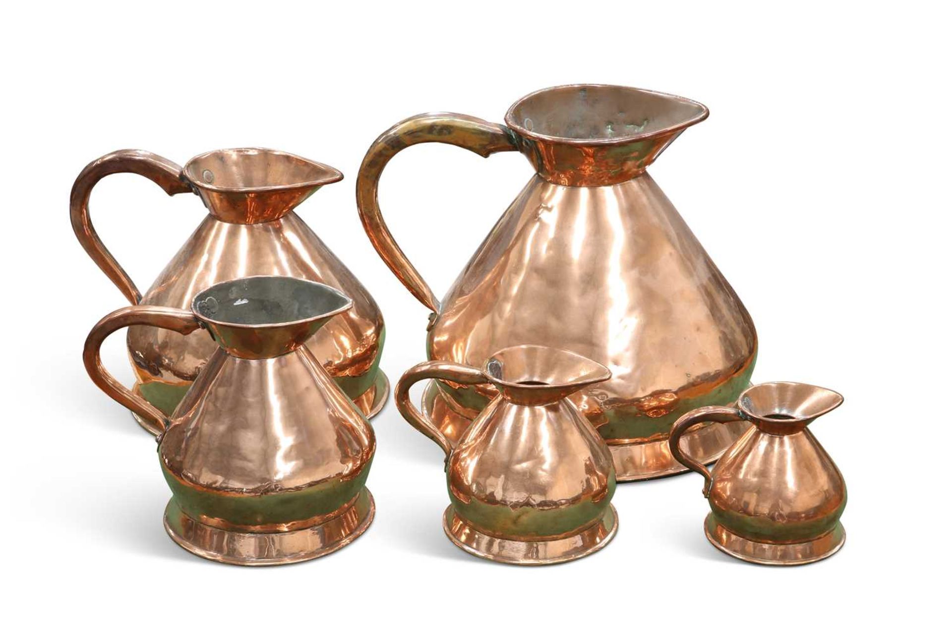 A GRADUATED MATCHED SET OF FIVE 19TH CENTURY COPPER MEASURES