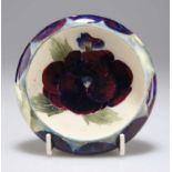 A WILLIAM MOORCROFT BURSLEM 'PANSY' PATTERN POTTERY TRINKET DISH