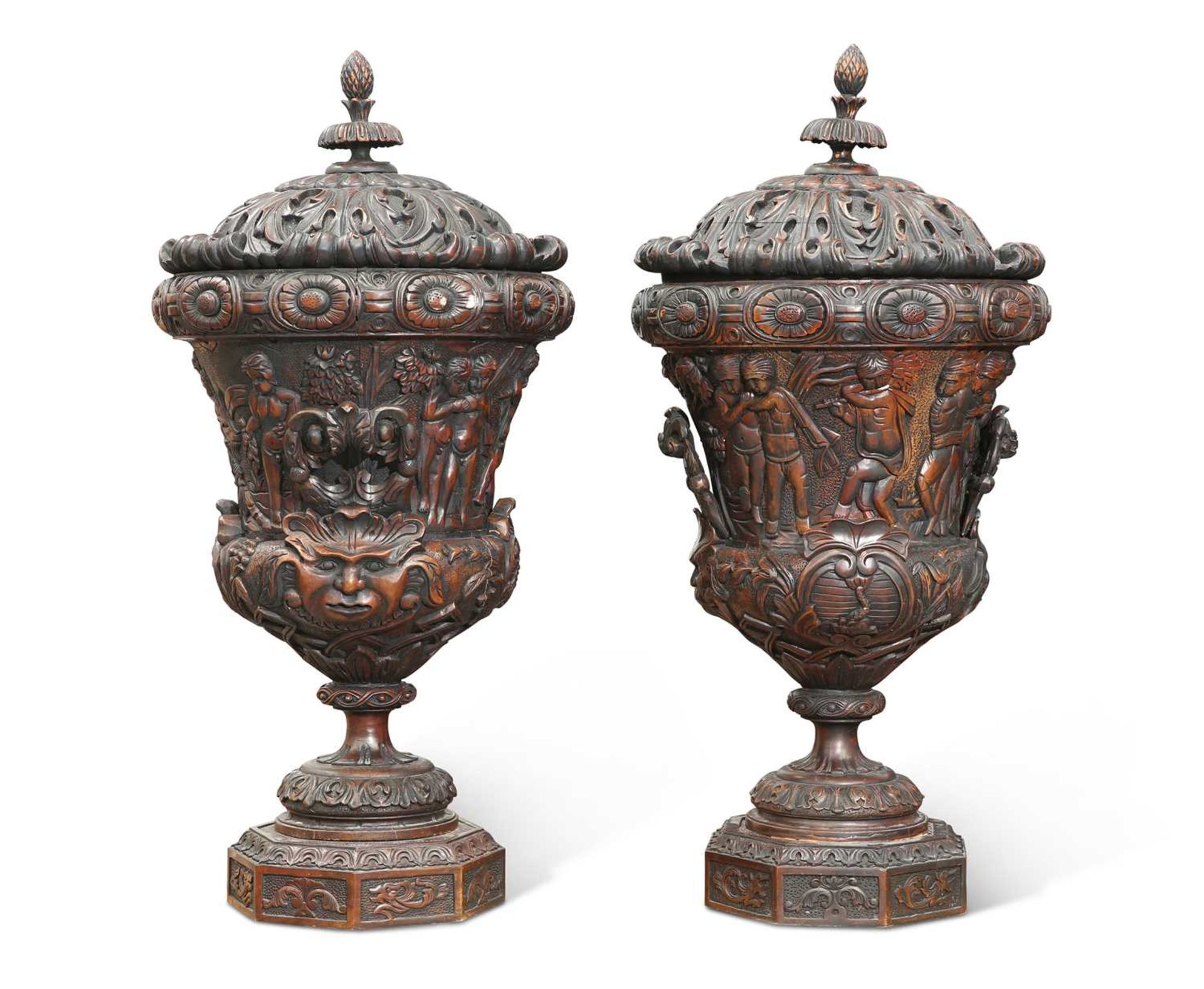 A LARGE PAIR OF CARVED WOOD URNS AND COVERS