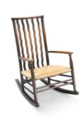 ATTRIBUTED TO MORRIS & CO FOR LIBERTY, A RUSH-SEATED ROCKING CHAIR