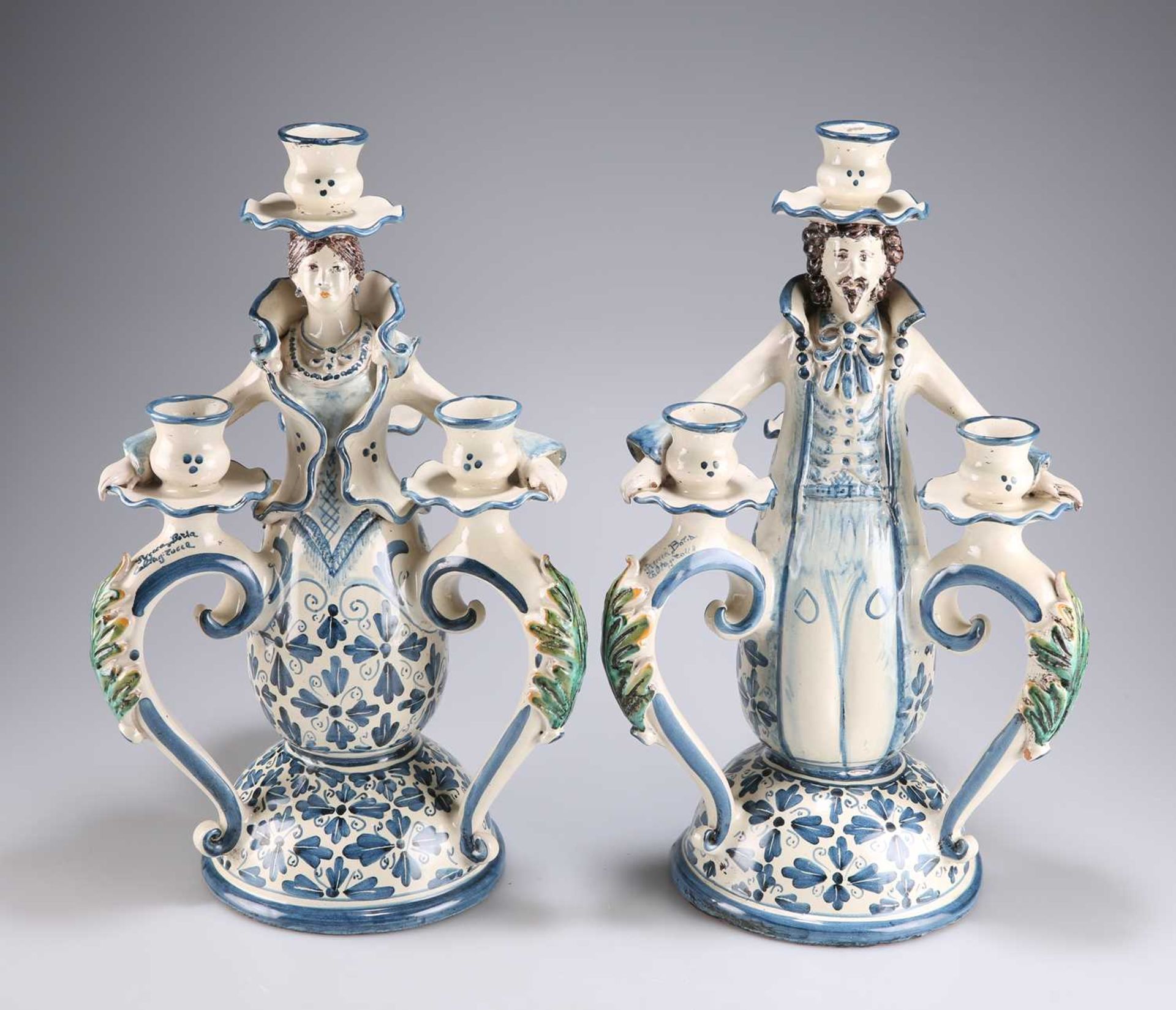 A PAIR OF CONTINENTAL FAÏENCE FIGURAL CANDELABRA, CIRCA 1900