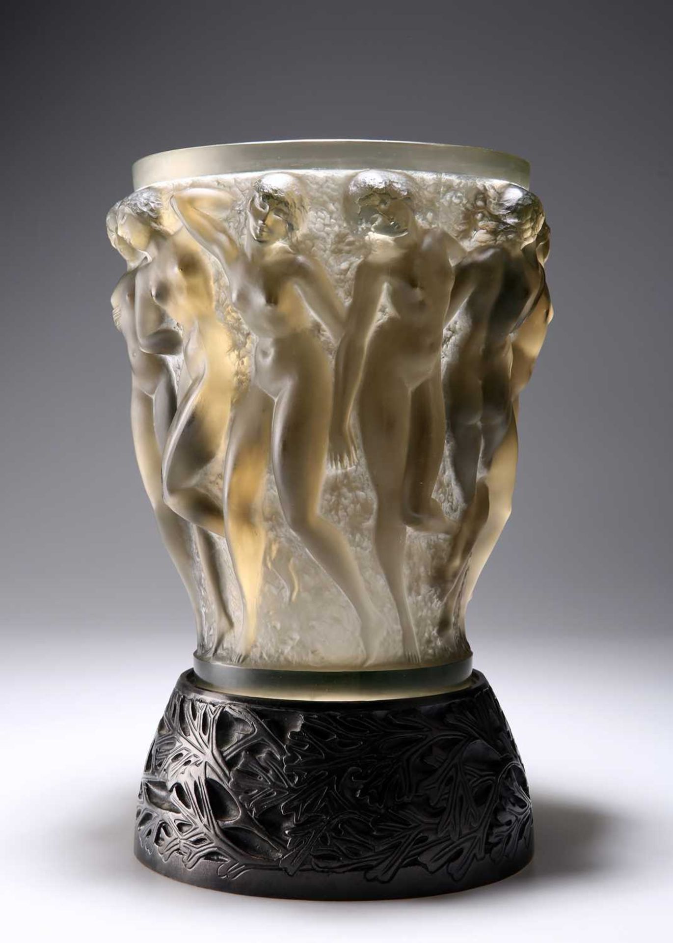 RENÉ LALIQUE (FRENCH, 1860-1945), A TOPAZ 'BACCHANTES' VASE WITH BRONZE STAND