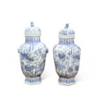 A LARGE PAIR OF CHINESE BLUE AND WHITE VASES AND COVERS