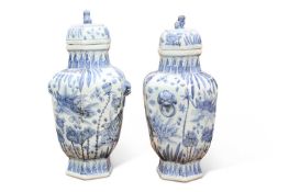 A LARGE PAIR OF CHINESE BLUE AND WHITE VASES AND COVERS