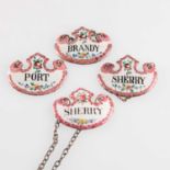 A SET OF FOUR 19TH CENTURY ENAMEL WINE LABELS