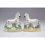 A PAIR OF 19TH CENTURY STAFFORDSHIRE POTTERY ZEBRAS