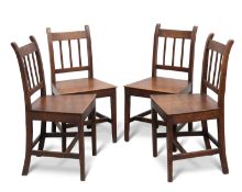 A SET OF FOUR EARLY 19TH CENTURY OAK DINING CHAIRS