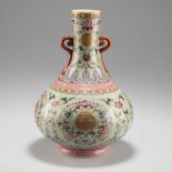 A CHINESE FAMILLE ROSE ENAMEL VASE