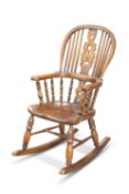 A PERIOD STYLE ELM AND OAK CHILD'S ROCKING CHAIR