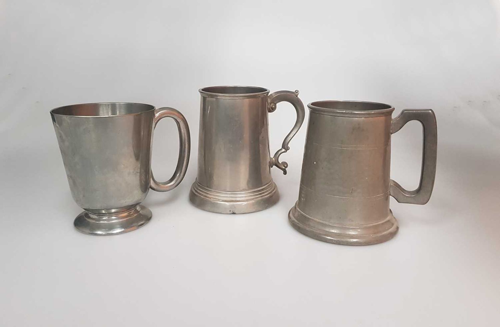 THREE VARIOUS PEWTER TANKARDS