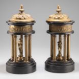 A PAIR OF 19TH CENTURY CONTINENTAL BLACK MARBLE AND GILT-BRASS MODELS OF CLASSICAL TEMPLES