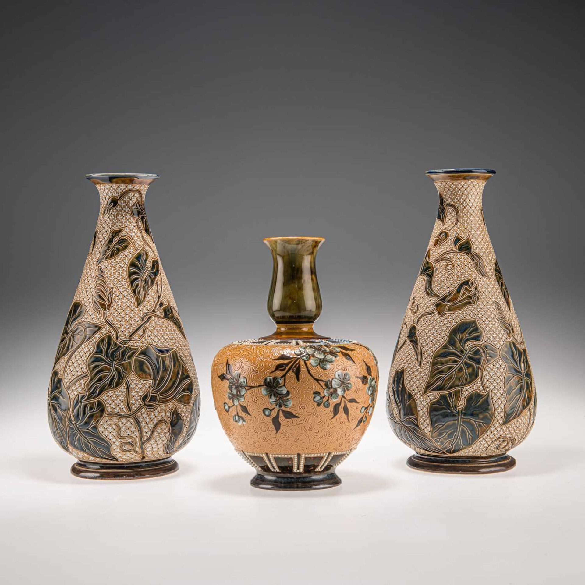 LOUISA J. DAVIS FOR DOULTON LAMBETH, A PAIR OF LATE 19TH CENTURY STONEWARE BOTTLE VASES