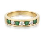 AN 18 CARAT GOLD EMERALD AND DIAMOND HALF HOOP RING