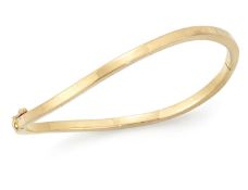 AN 18 CARAT GOLD BANGLE