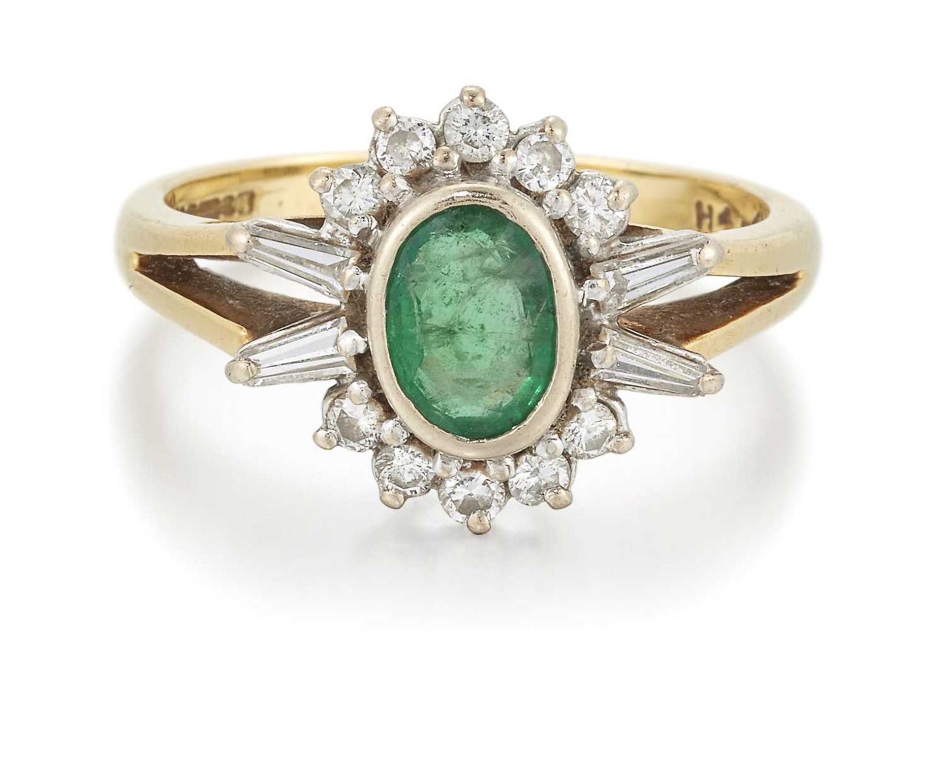 AN 18 CARAT GOLD EMERALD AND DIAMOND CLUSTER RING