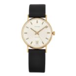 A 9 CARAT GOLD GARRARD STRAP WATCH