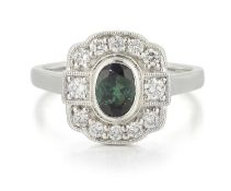 A PLATINUM GREEN TOURMALINE AND DIAMOND CLUSTER RING