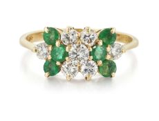 AN 18 CARAT GOLD EMERALD AND DIAMOND RING