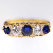 AN 18 CARAT GOLD SAPPHIRE AND DIAMOND RING