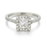 A PLATINUM PRINCESS-CUT DIAMOND CLUSTER RING