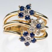 A SAPPHIRE AND DIAMOND TRIPLE CLUSTER RING
