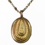 A VICTORIAN LOCKET PENDANT ON CHAIN