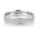 AN 18 CARAT WHITE GOLD DIAMOND HALF HOOP RING