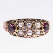 A LATE VICTORIAN 9 CARAT GOLD GARNET AND SEED PEARL RING