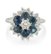 AN 18 CARAT WHITE GOLD SAPPHIRE AND DIAMOND CLUSTER RING