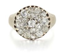 AN OLD-CUT DIAMOND CLUSTER RING