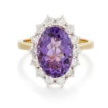 AN 18 CARAT GOLD AMETHYST AND DIAMOND CLUSTER RING