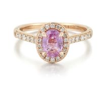 AN 18 CARAT ROSE GOLD PINK SAPPHIRE AND DIAMOND CLUSTER RING