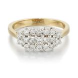 AN 18 CARAT GOLD DIAMOND CLUSTER RING