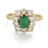 AN 18 CARAT GOLD EMERALD AND DIAMOND CLUSTER RING