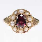 A MID-19TH CENTURY GARNET AND SPLIT PEARL CLUSTER RING