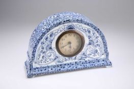 AN AESTHETIC MOVEMENT BLUE TRANSFER-PRINTED MANTEL CLOCK, CIRCA 1880