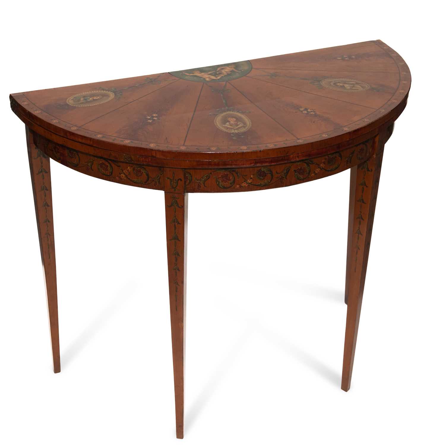 A LATE VICTORIAN PAINTED SATINWOOD FOLDOVER DEMILUNE CARD TABLE