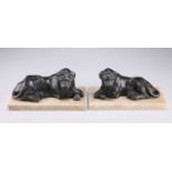 A PAIR OF 19TH CENTURY LEAD MODELS OF LIONS