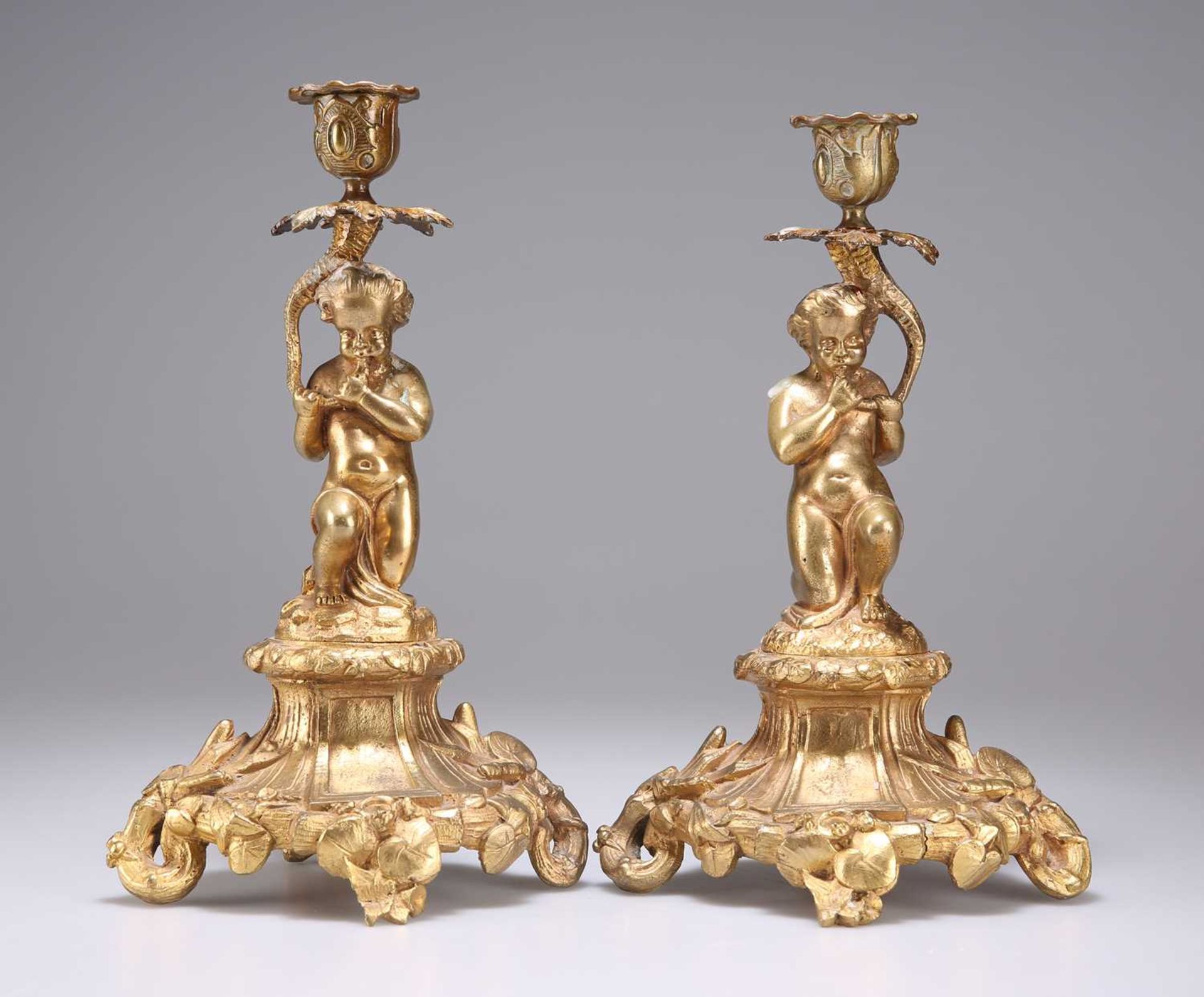 A PAIR OF 19TH CENTURY GILT-BRONZE CANDLESTICKS