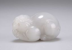 A CHINESE PALE JADE CARVING OF A QILIN