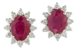 A PAIR OF RUBY AND DIAMOND CLUSTER EARRINGS