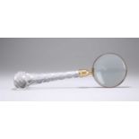 A COUNTRY HOUSE BRASS-MOUNTED MAGNIFYING GLASS