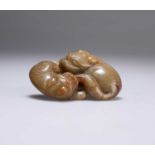 A CHINESE JADE GROUP OF A BUDDHISTIC LION AND PUP