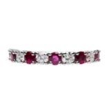 A PLATINUM RUBY AND DIAMOND HALF HOOP RING