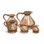 A GRADUATED MATCHED SET OF FIVE 19TH CENTURY COPPER MEASURES
