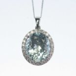 AN 18 CARAT WHITE GOLD AQUAMARINE AND DIAMOND CLUSTER PENDANT ON CHAIN