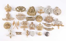 A COLLECTION OF MILITARY CAP BADGES, SHOULDER TITLES AND BUTTONS