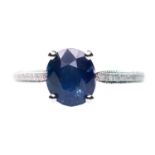 A PLATINUM SAPPHIRE AND DIAMOND RING