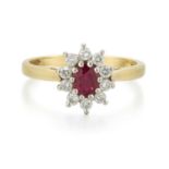 AN 18 CARAT GOLD RUBY AND DIAMOND CLUSTER RING